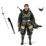 Figurine articulée jin sakai en armure noire et or avec accents verts tenant un katana dans le fourreau ghost of tsushima