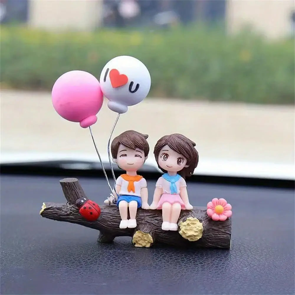 Figurine romantique en résine d un couple assis sur un tronc avec ballons rose et blanc décoration love you cadeau parfait