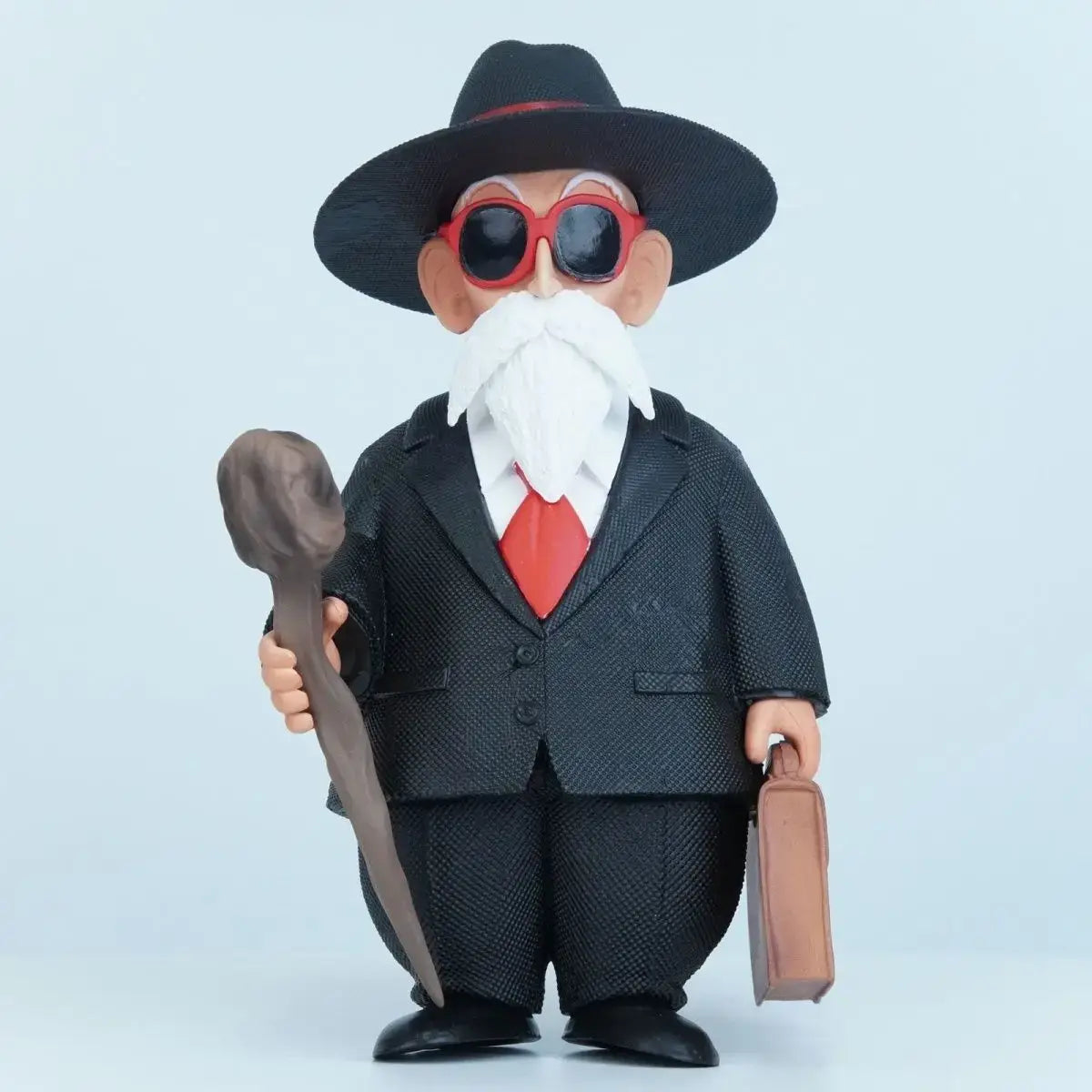 Figurine dragon ball tortue geniale avec chapeau fedora noir lunettes rouges barbe blanche costume noir texturé et cravate rouge