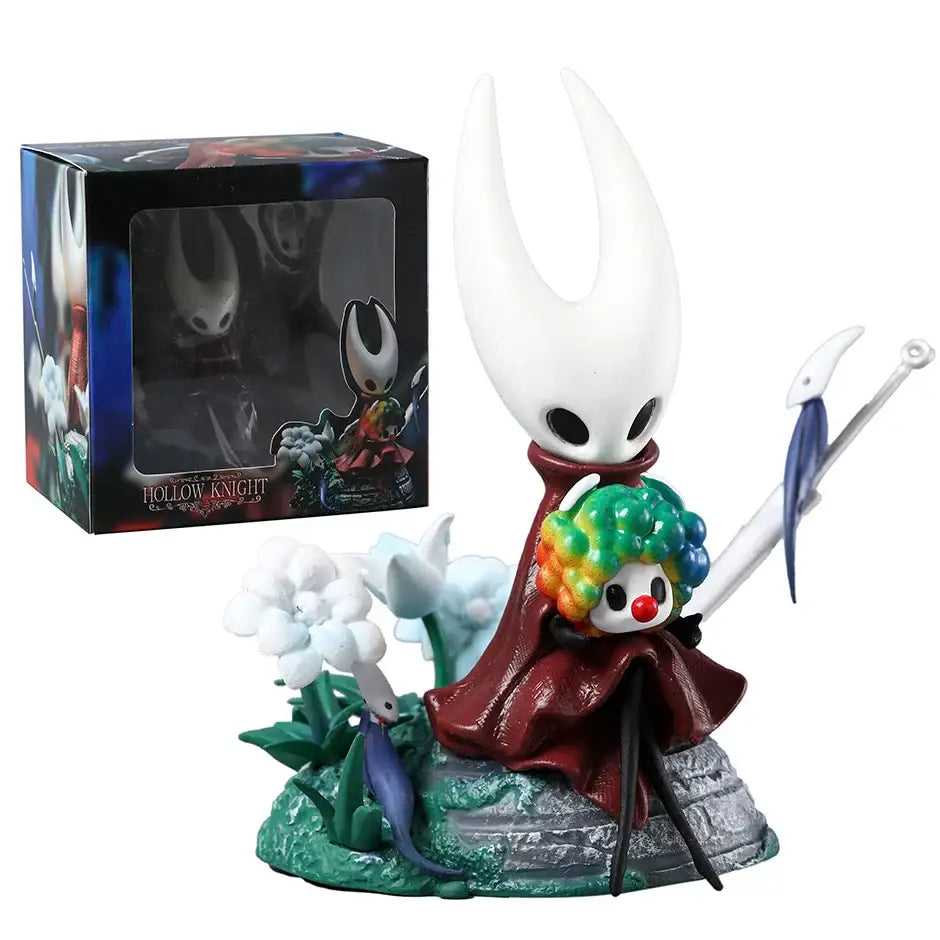 Figurine hollow knight hornet blanche avec cape rouge et masque clown arc-en-ciel sur socle rocheux et fleurs blanches