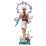Figurine one piece monkey d. luffy gear 5 blanche avec muscles détaillés épée bleue et effets énergie violet-bleu