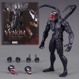 Figuine venom marvel legends noire avec motifs blancs éclairs langue rouge présentée avec son emballage collection marvel legends
