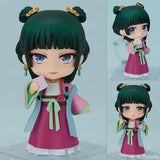 Figurine chibi les carnets de l’apothicaire avec cheveux verts ornés détails soignés tenue carnaval colorée boîte illustrée