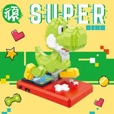 Figurines micro blocs super mario yoshi en briques mini, vert et blanc, posé sur console rouge nintendo ds