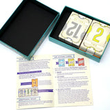 Boîte flip 7 jeu de société en teal avec cartes spéciales à faces crème et chiffres jaunes, guide inclus, idéal magasins de jouets