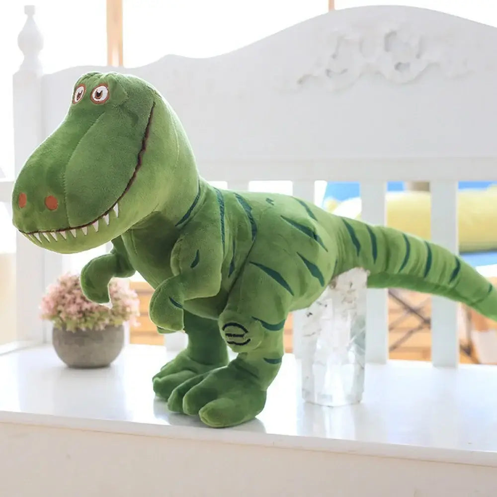 Peluche dinosaure mignon grande de couleur verte avec rayures foncées et dents blanches en tissu doux
