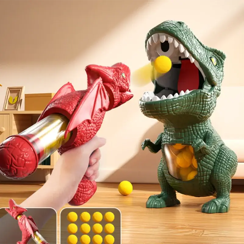 Pistolet à air tir dino vert en plastique avec bouche ouverte et balles jaunes dans le ventre pour aventure préhistorique