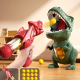Pistolet à air tir dino vert en plastique avec bouche ouverte et balles jaunes dans le ventre pour aventure préhistorique