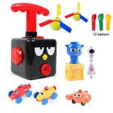 Jouet avec ballons de baudruche en plastique noir avec poignée rouge et visage oiseau cartoon visible de face