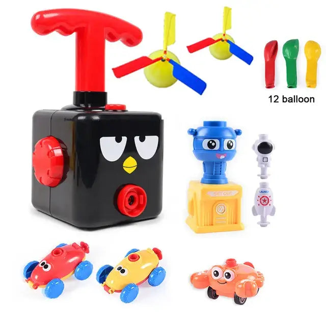 Jouet avec ballons de baudruche en plastique noir avec poignée rouge et visage oiseau cartoon visible de face
