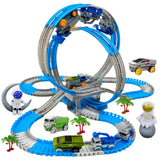 Jouet circuit piste spatiale electrique en plastique bleu et gris avec loops, rampes et mini véhicules pour circuit voiture électrique
