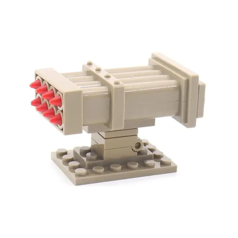 Jouet lego lanceur missiles en plastique tan avec projectiles rouges pour missiles lego de construction