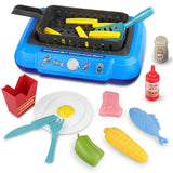 Boîte de cuisine couleur changeante en plastique bleu avec surface de grillade noire et accessoires alimentaires colorés