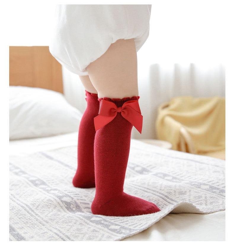 Red baby socks with bow ties