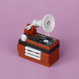 Vintage lego moc gramophone with a brown body white horn as a lego adulte accessoire for salle de jeux casino