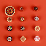 Colorful lego moc alimentaire miniature food-themed fridge magnets on vibrant orange background