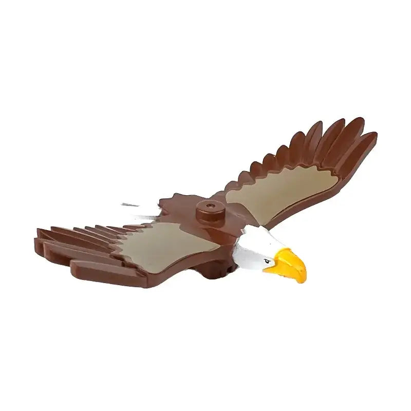 Lego moc animal en plastique représentant un aigle brun et blanc avec un bec jaune et des ailes déployées lego ferme