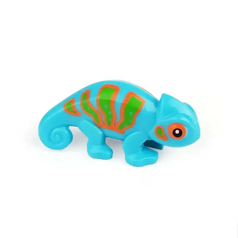 Lego moc animaux de ferme featuring a vibrant turquoise plastic chameleon toy with green and orange stripes on its back
