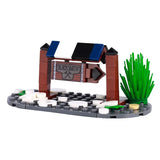 Lego moc medieval boutique de forgeron en briques marron et bleu avec enseigne marteaux croisés pour déguisement carnaval