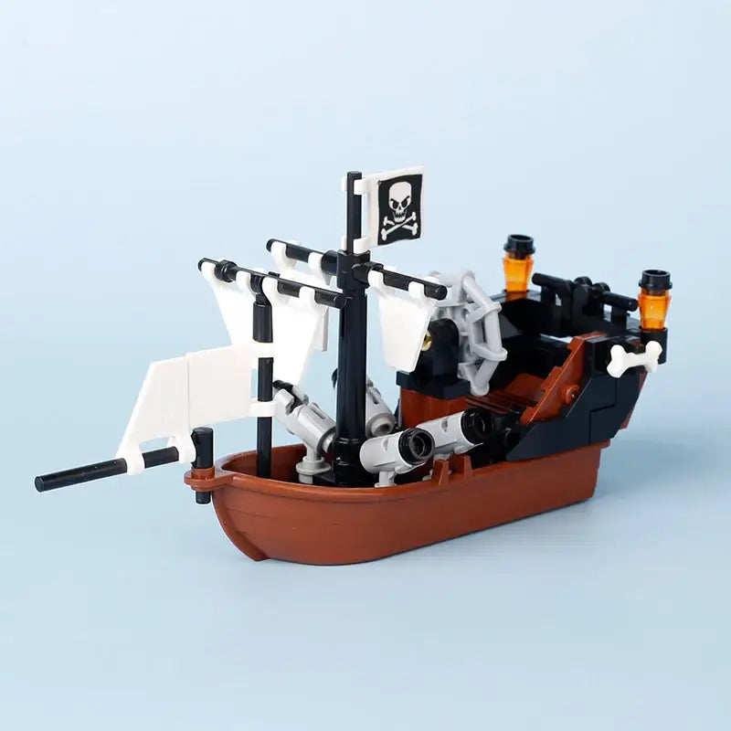 Lego moc medieval navire pirate en plastique marron et noir avec voiles blanches et cannons gris pour déguisement carnaval