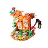 Lego moc medieval boutique miniaturisée en briques orange avec oiseau blanc sur le toit et champignon rouge blanc