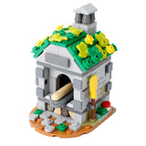 Lego moc medieval dèguisement carnaval d une boulangerie en briques lego grises toit vert avec fleurs et four à pain