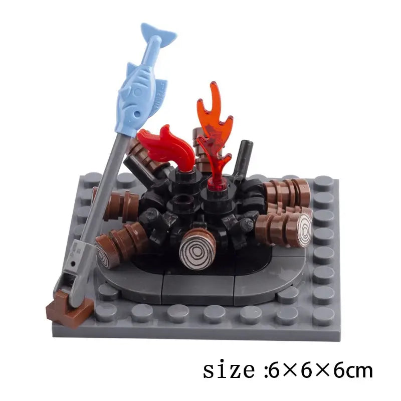 Lego moc medieval avec une lance bleue en forme de poisson et un feu de camp en lego pour déguisement carnaval