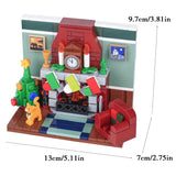 Lego moc décor de noël avec cheminée en briques rouges, horloge, bougies, sapin vert, chat orange et fauteuil rouge