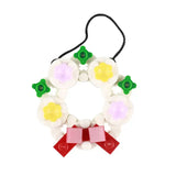 Lego moc décor de noël une couronne de fête en lego colorée avec fleurs blanches jaunes violettes et nœud rouge