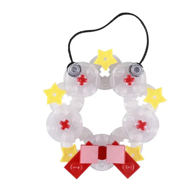 Clear plastic lego moc wreath ornament with yellow star accents and pink bow for lego noël 2025 décor