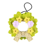 Lego moc de noël 2025 ornement couronne en lego vert citron avec étoiles jaunes fleurs lavande et nœud beige