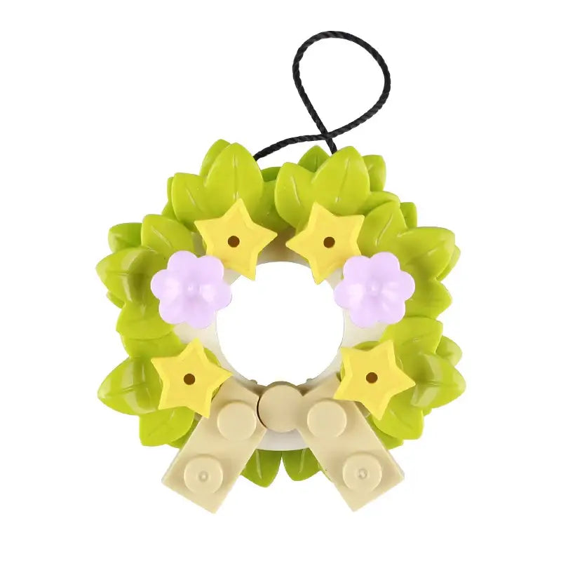 Lego moc de noël 2025 ornement couronne en lego vert citron avec étoiles jaunes fleurs lavande et nœud beige