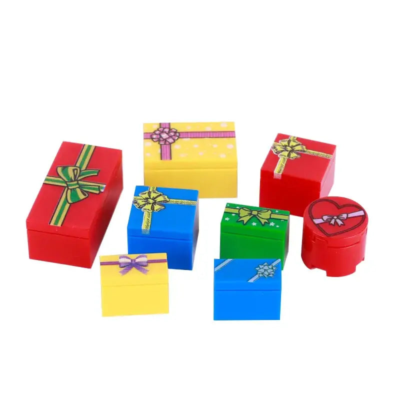 Colorful lego moc gift boxes with printed bows in red yellow blue green and a heart-shaped box for lego noël 2025