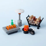 Lego moc accessoire lego avec un coin feu extérieur gris et noir avec flammes orange et meuble patio moderne