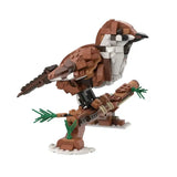 Lego moc oiseaux brown and white perched on branch with green foliage in lego moc animaux volants collection