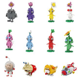 Une collection de figurines pikmin colorées en lego moc pikmin olimar avec un design blocky détaillé