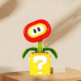 Lego moc super mario modèle emblématique super mario fleur de feu en lego rouge jaune et vert sur base bloc point d interrogation