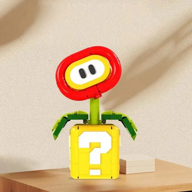 Lego moc super mario modèle emblématique super mario fleur de feu en lego rouge jaune et vert sur base bloc point d interrogation