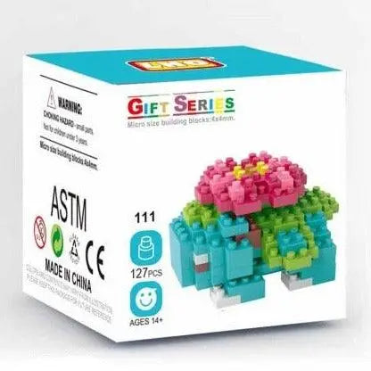 La boîte mini brique figurines pokémon contient un modèle bulbasaur coloré en nano bricks de 127 pièces