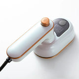 Mini fer à vapeur portatif blanc avec accents dorés et design moderne pour un mini fer repasser efficace