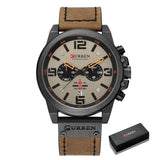 Montre à quartz homme avec cadran beige, aiguilles orange, sous-cadrans noirs, bracelet cuir marron et boîtier acier inoxydable, accessoire intemporel au design élégant
