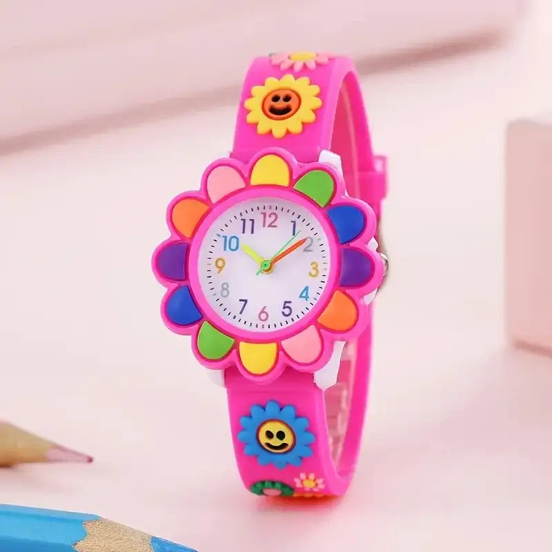 Montre fleur enfant rose en forme de fleur avec détails de pétales colorés et charms tournesol souriants pour enfant