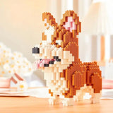 Figurine de chien corgi orange et crème en nanoblock mini briques avec accents roses dans mini briques chiens