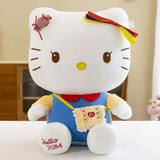 Peluche anime hello kitty en peluche blanche avec salopette bleue noeud rouge et ruban coloré dans les cheveux