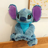 Peluche géante disney stitch angel 80cm avec fourrure bleue, oreilles violettes et ventre turquoise en tissu peluche