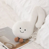 Peluche instrument musique 30cm en forme de note musicale blanche avec yeux brodés et pieds en pompon brun idéale déguisement carnaval