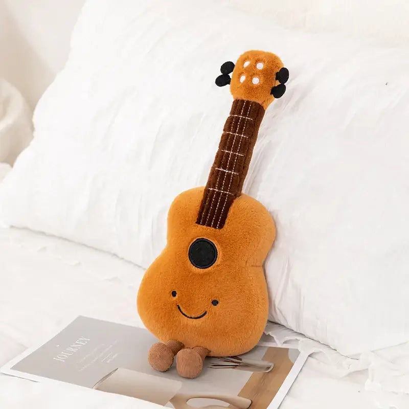 Peluche instrument musique 30cm ukulélé orange avec visage souriant et cou en velours côtelé pour déguisement carnaval
