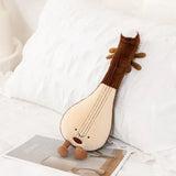 Peluche instrument de musique 30cm doux en marron et crème avec visage souriant et petites pieds parfait pour déguisement carnaval