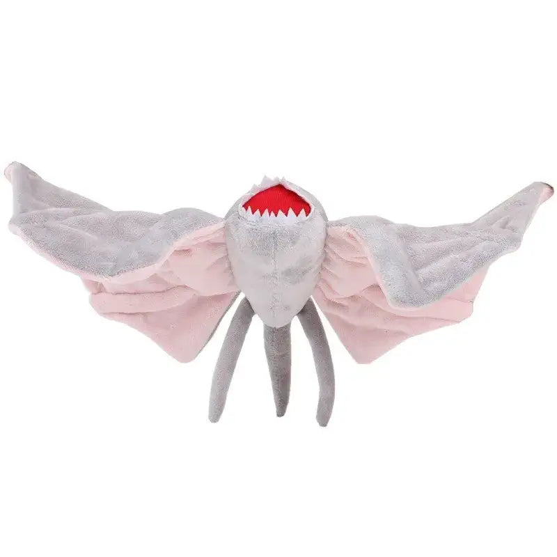 Peluche stranger things personnage avec grandes ailes roses et grises, dents acérées et trois pattes grises idéale pour déguisement carnaval