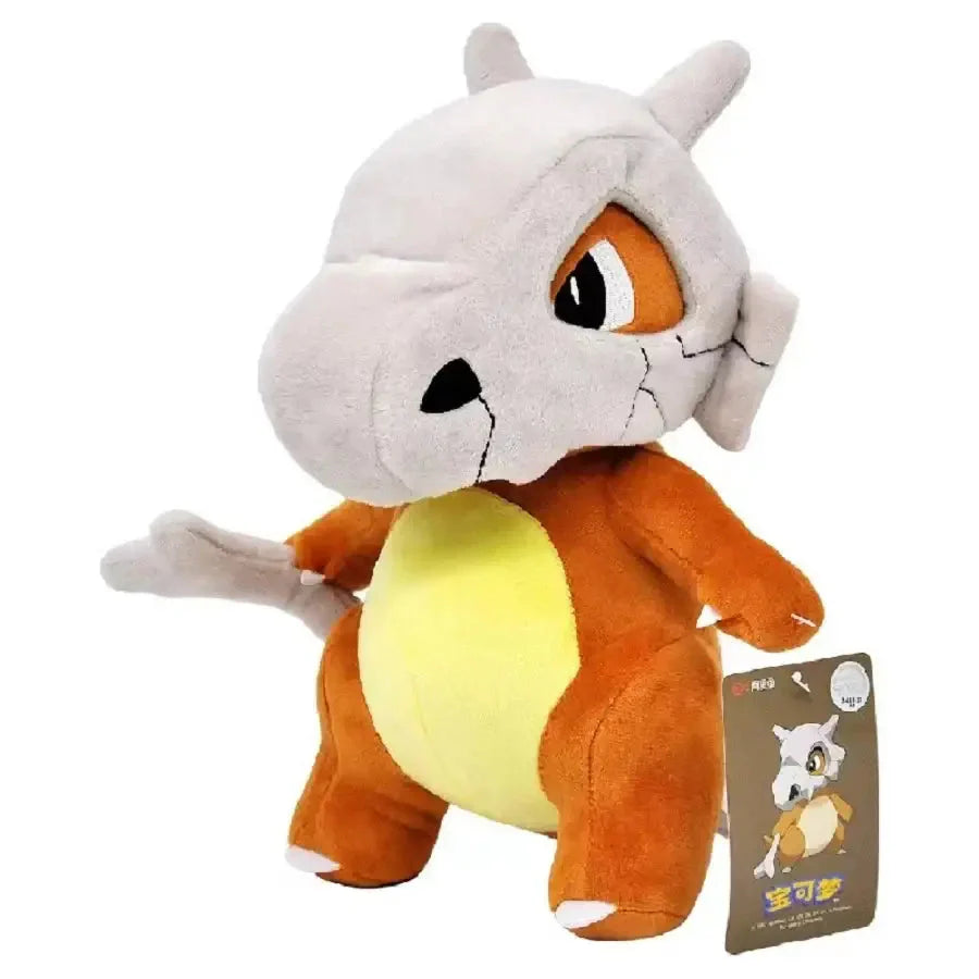 Ravissante peluche pokémon cubone osselait douce avec tête en forme de crâne grise et corps orange jaune